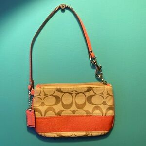 Coach Signature canvas wristlet
